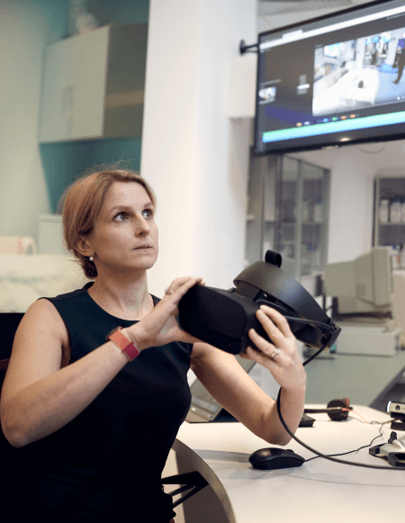 Image of a person using VR inside of a virtual ward