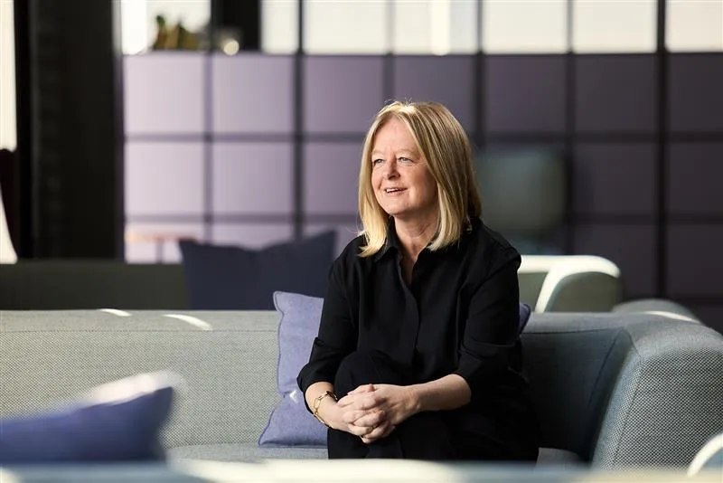 BT Group's Chief Executive, Allison Kirby, in mid-conversation from a couch in the BT office.