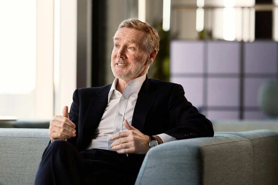 BT Group's Chairman, Adam Crozier, in mid-conversation from a couch in the BT office.