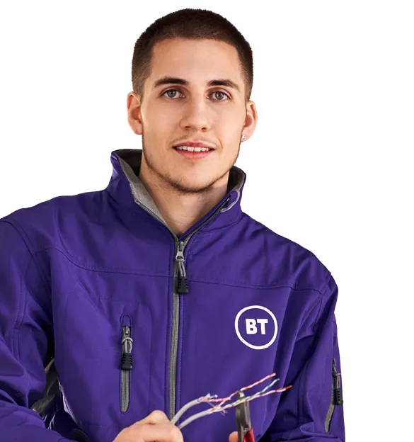 A BT apprentice on a ladder, holding wires and pliers