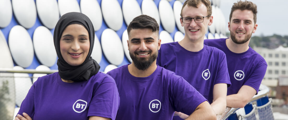 Four colleagues wearing purple BT t-shirts