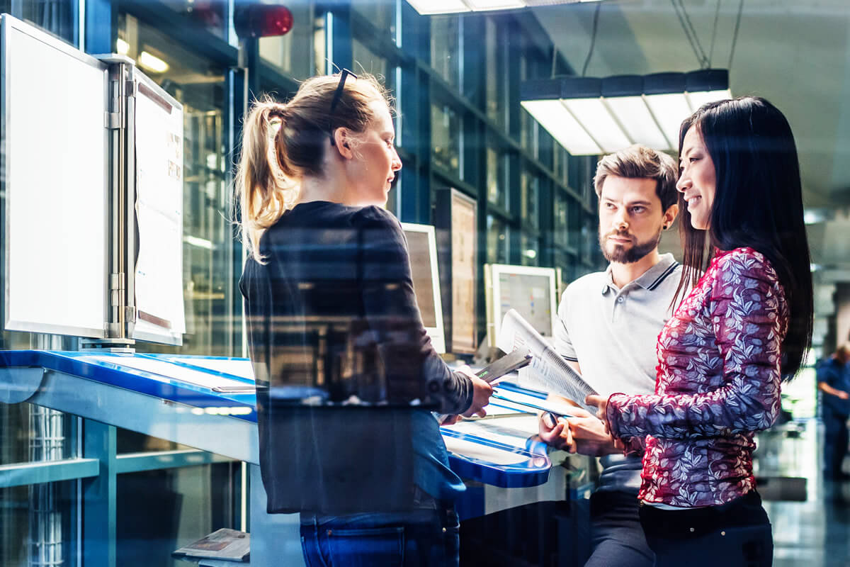 Group standing having a meeting