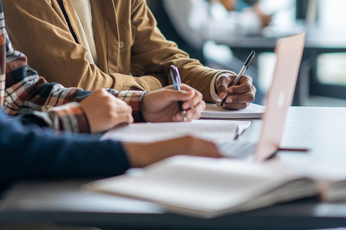 Group of people working on a laptop