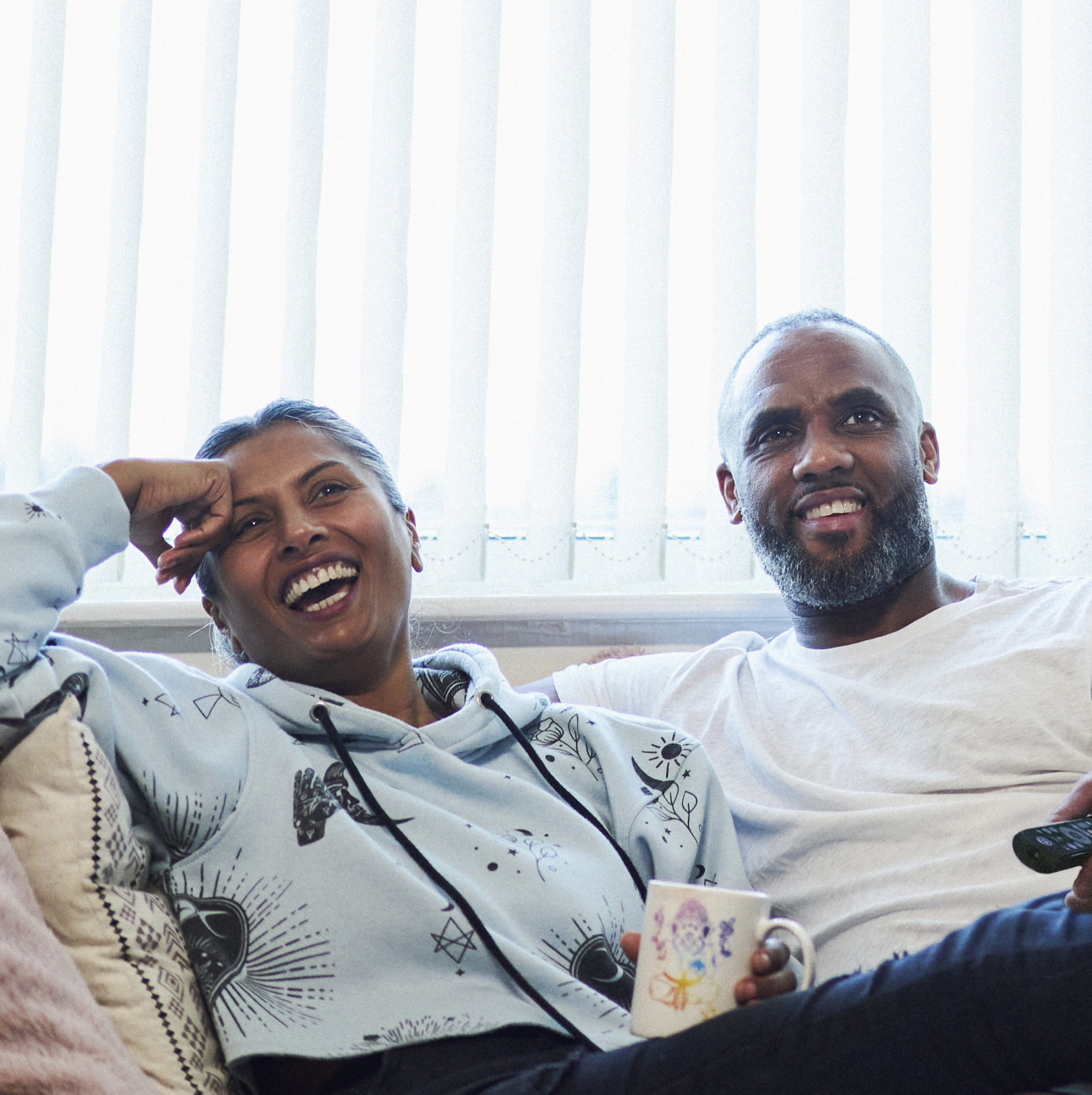 Man and woman sitting on a sofa