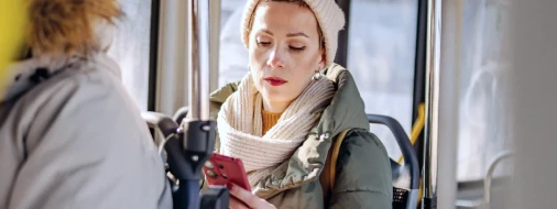 Person using a phone while travelling